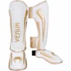 Venum Elite Standup Shinguards - MMA Factory -MMA FACTORY Shop 4456f465db4946b65f5b51fda9a8bf8a5407bd51 shinguard elite white gold 1500 01 1