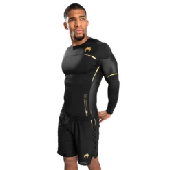 Venum Tempest 2.0 Rashguard - Long Sleeves - MMA Factory -MMA FACTORY Shop b92d96a10807b4173ea2925105e771dd0afd43a1 rashguards ls tempest2.0 black gold 04.5