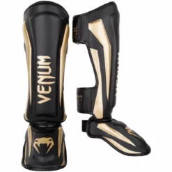 Venum Elite Standup Shinguards - MMA Factory -MMA FACTORY Shop venum 1394 126 m venum 1394 126 m galery image 1 shinguard elite black gold 1500 01 1 1